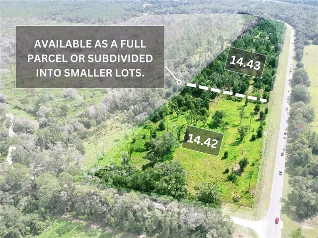 a sign broad in front of flowers