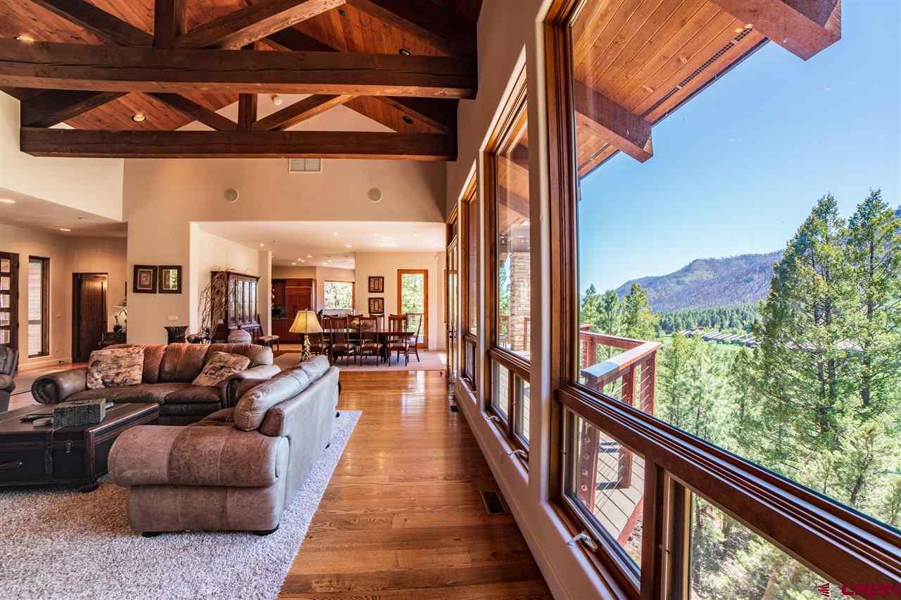 258 Goulding Creek Road Durango, CO 81301 - Photo 11 of 35 a view of balcony with couches and wooden floor