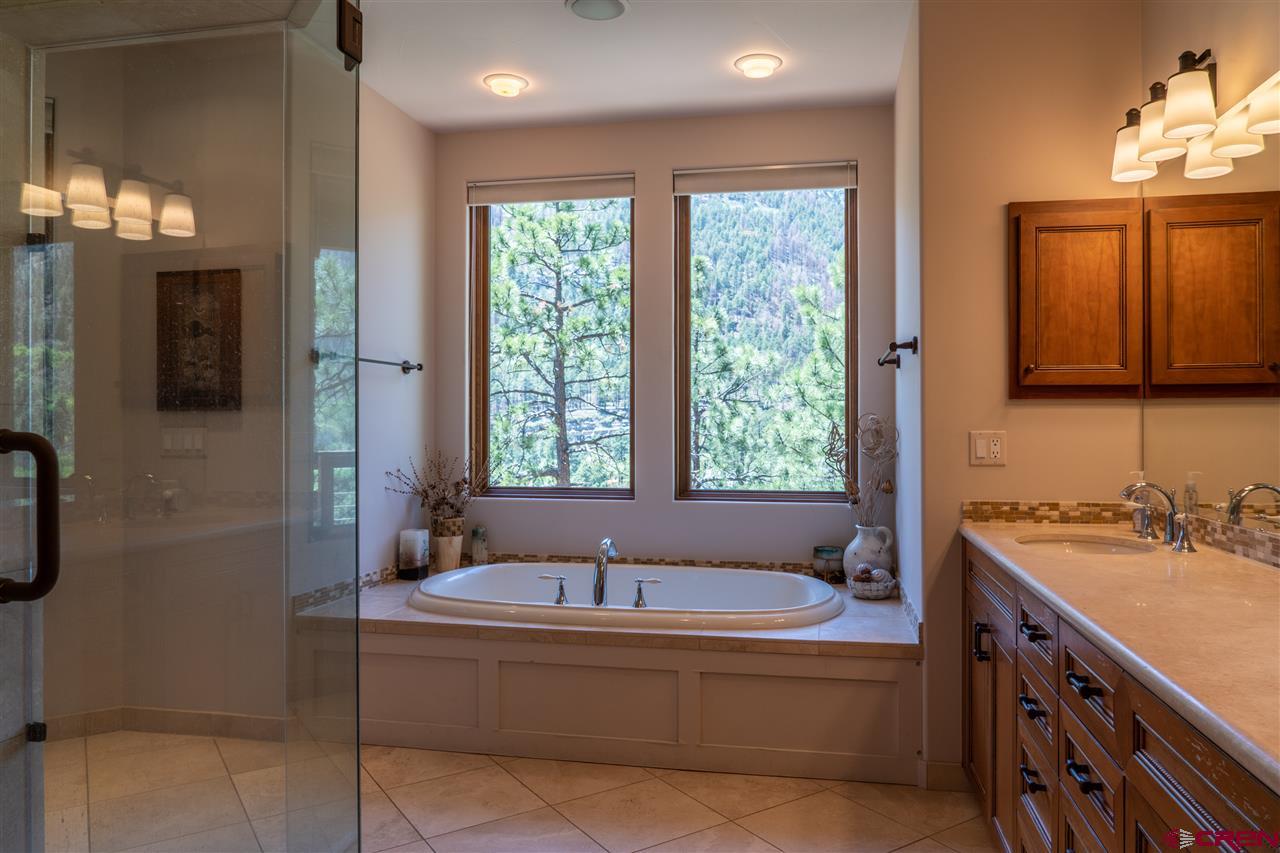 258 Goulding Creek Road Durango, CO 81301 - Photo 15 of 35 a spacious bathroom with sink shower and bathtub
