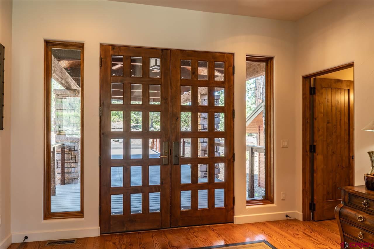 258 Goulding Creek Road Durango, CO 81301 - Photo 2 of 35 a view of an entryway with wooden floor and door