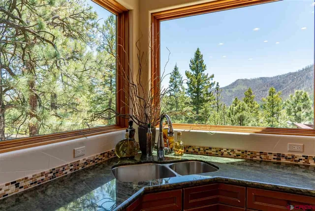 a view of a sink and table in a balcony