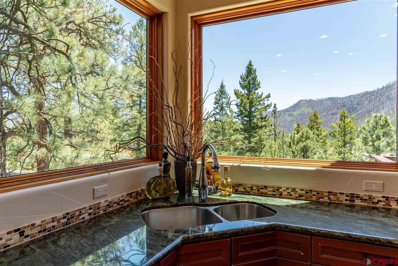 258 Goulding Creek Road Durango, CO 81301 - Photo 9 of 35 a view of a sink and table in a balcony