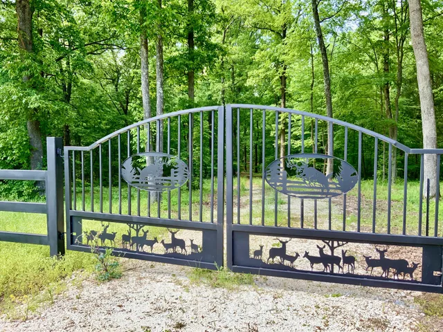 a view of a deck with a floor to ceiling window next to a yard