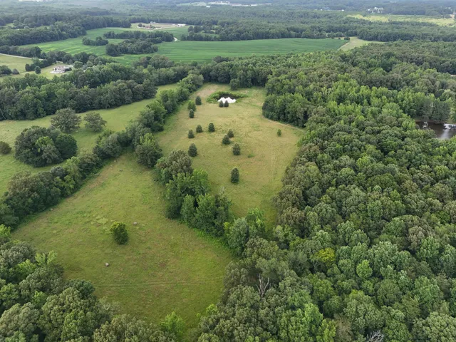 a aerial view of a houses with a yard
