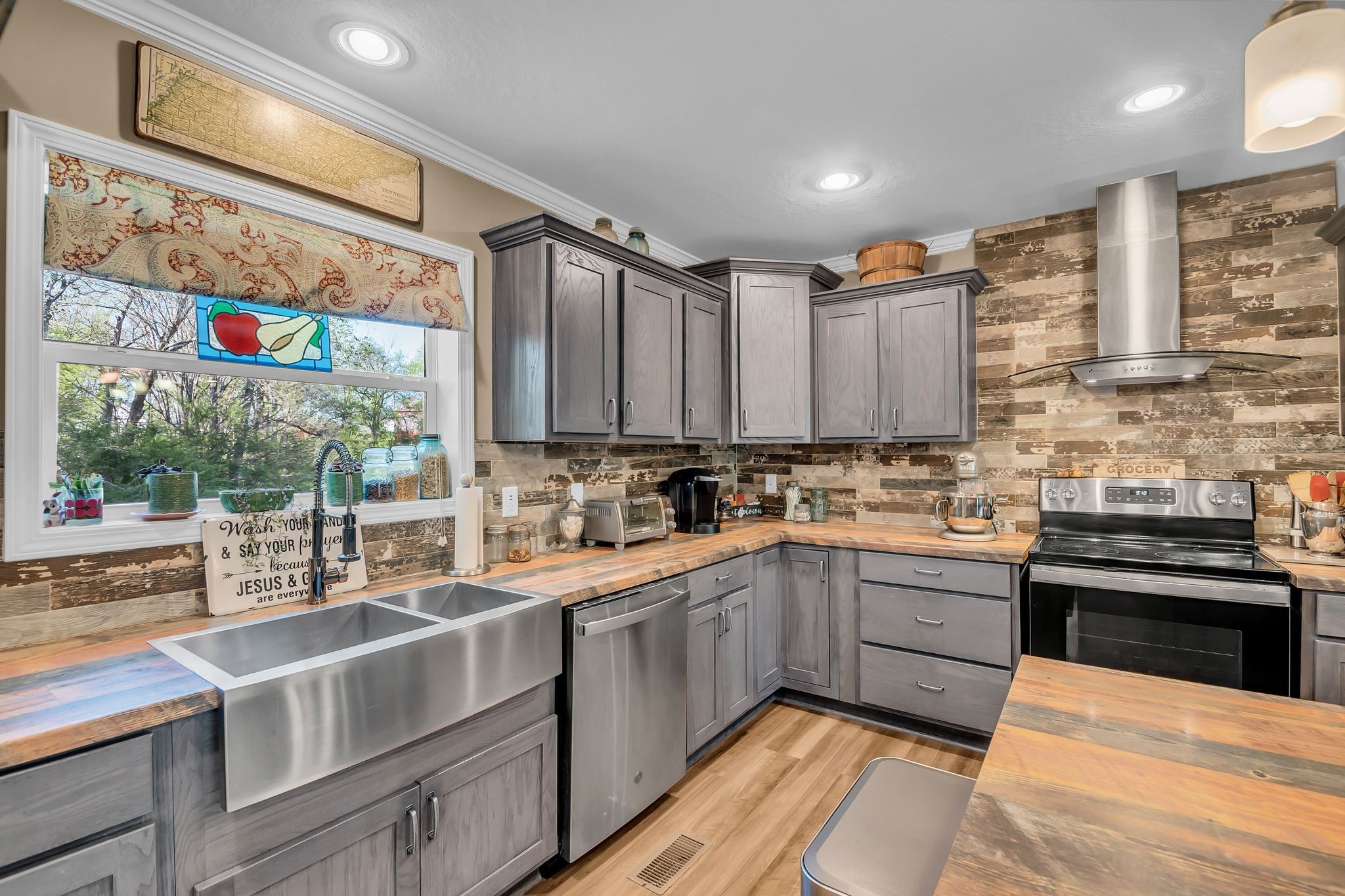 4241 Tanyard Hill Road Lynchburg, TN 37352 - Photo 12 of 50 a kitchen with stainless steel appliances kitchen island granite countertop a sink and cabinets