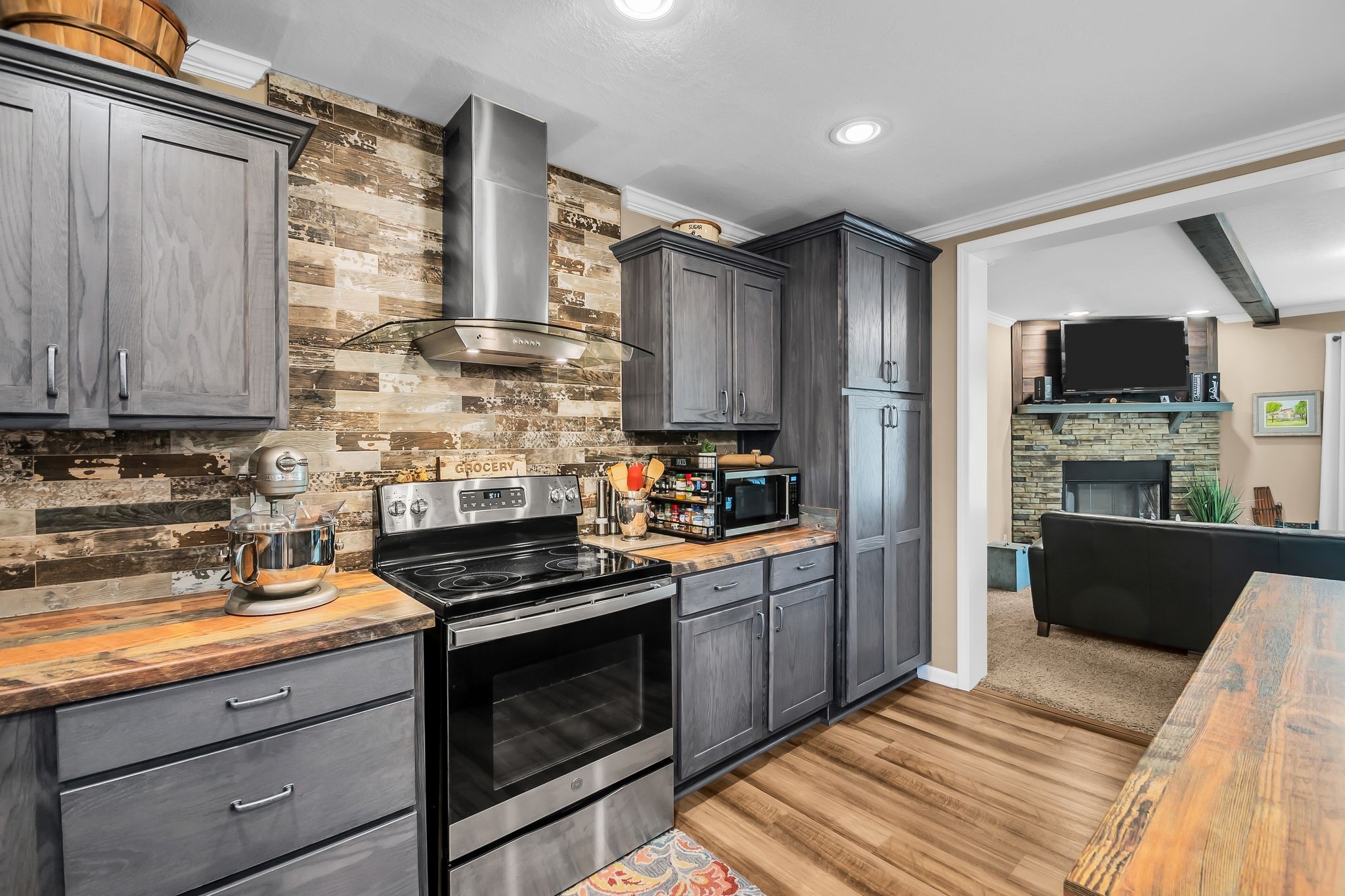 4241 Tanyard Hill Road Lynchburg, TN 37352 - Photo 13 of 50 a kitchen with stainless steel appliances a stove sink and cabinets