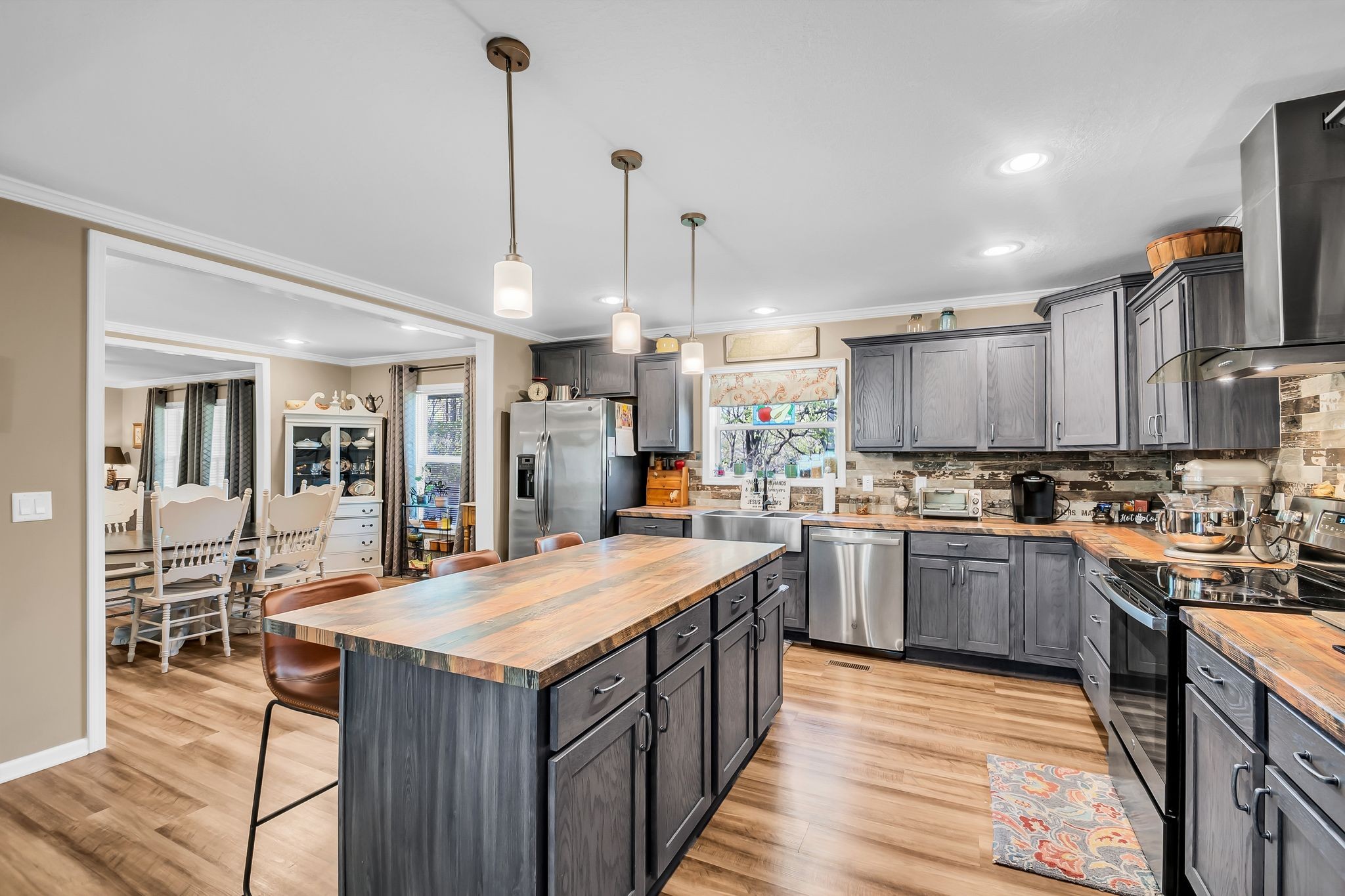 4241 Tanyard Hill Road Lynchburg, TN 37352 - Photo 14 of 50 a kitchen with a stove sink and refrigerator