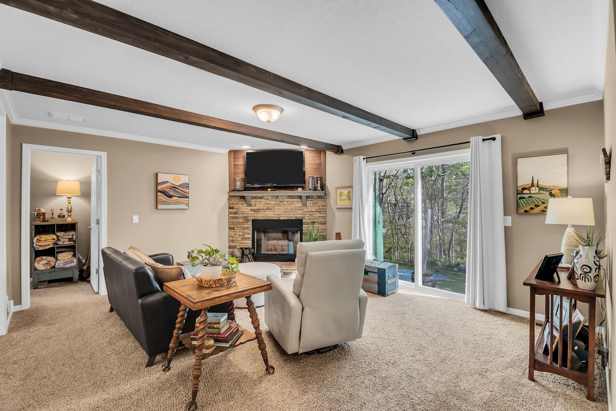 4241 Tanyard Hill Road Lynchburg, TN 37352 - Photo 15 of 50 a living room with furniture a fireplace and a flat screen tv