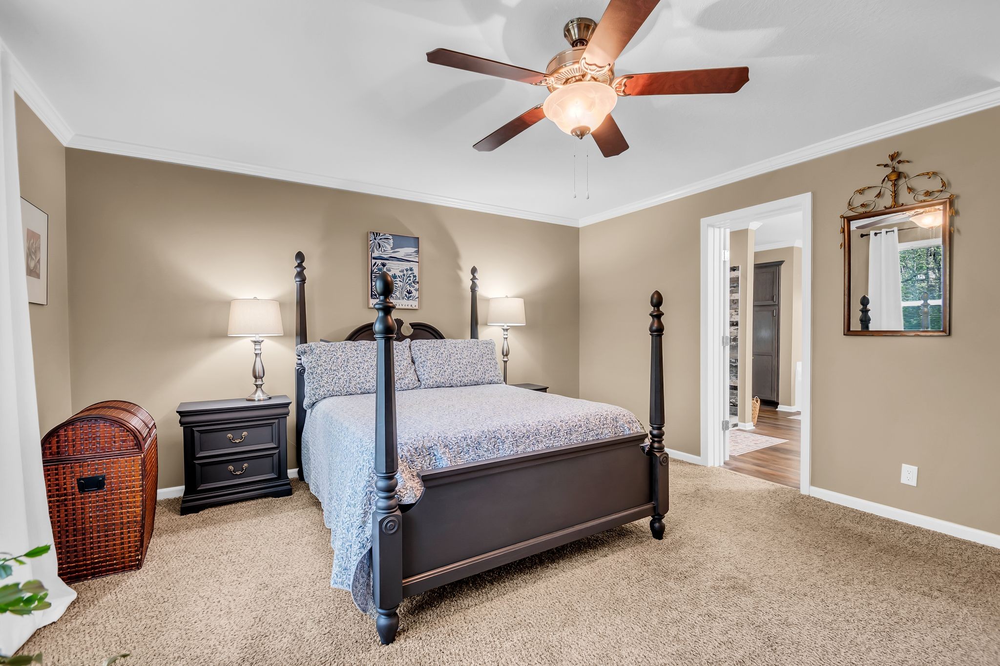 4241 Tanyard Hill Road Lynchburg, TN 37352 - Photo 19 of 50 a bedroom with a bed dresser and a chandelier