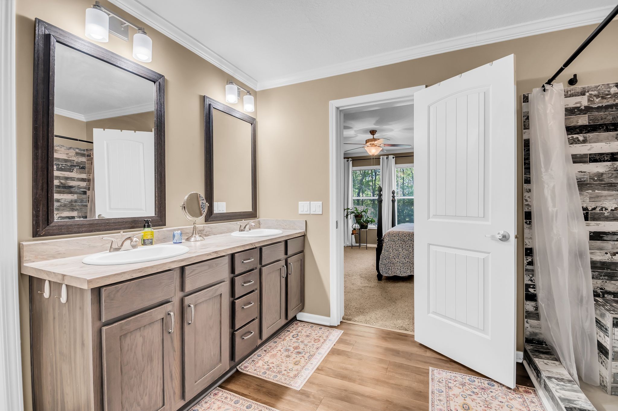 4241 Tanyard Hill Road Lynchburg, TN 37352 - Photo 20 of 50 a bathroom with a double vanity sink and a mirror