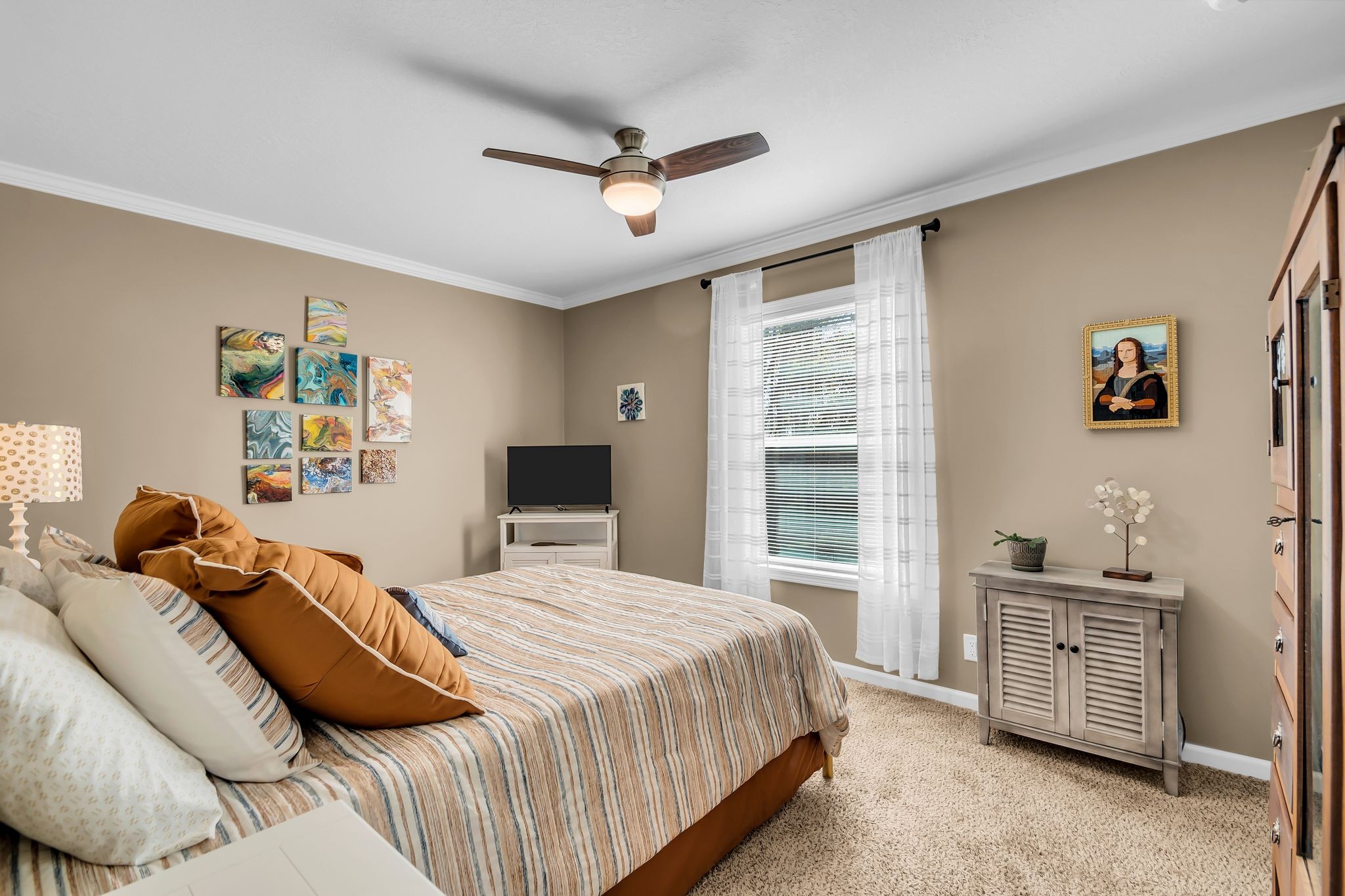 4241 Tanyard Hill Road Lynchburg, TN 37352 - Photo 24 of 50 a bedroom with a large bed and a window