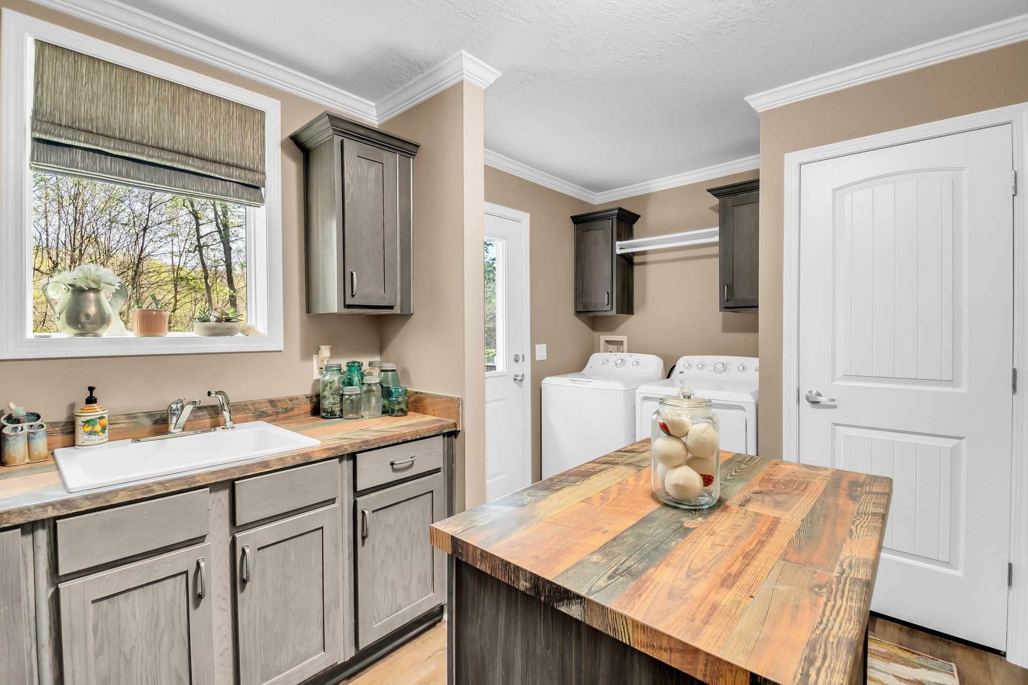 4241 Tanyard Hill Road Lynchburg, TN 37352 - Photo 30 of 50 a kitchen with a sink refrigerator and cabinets