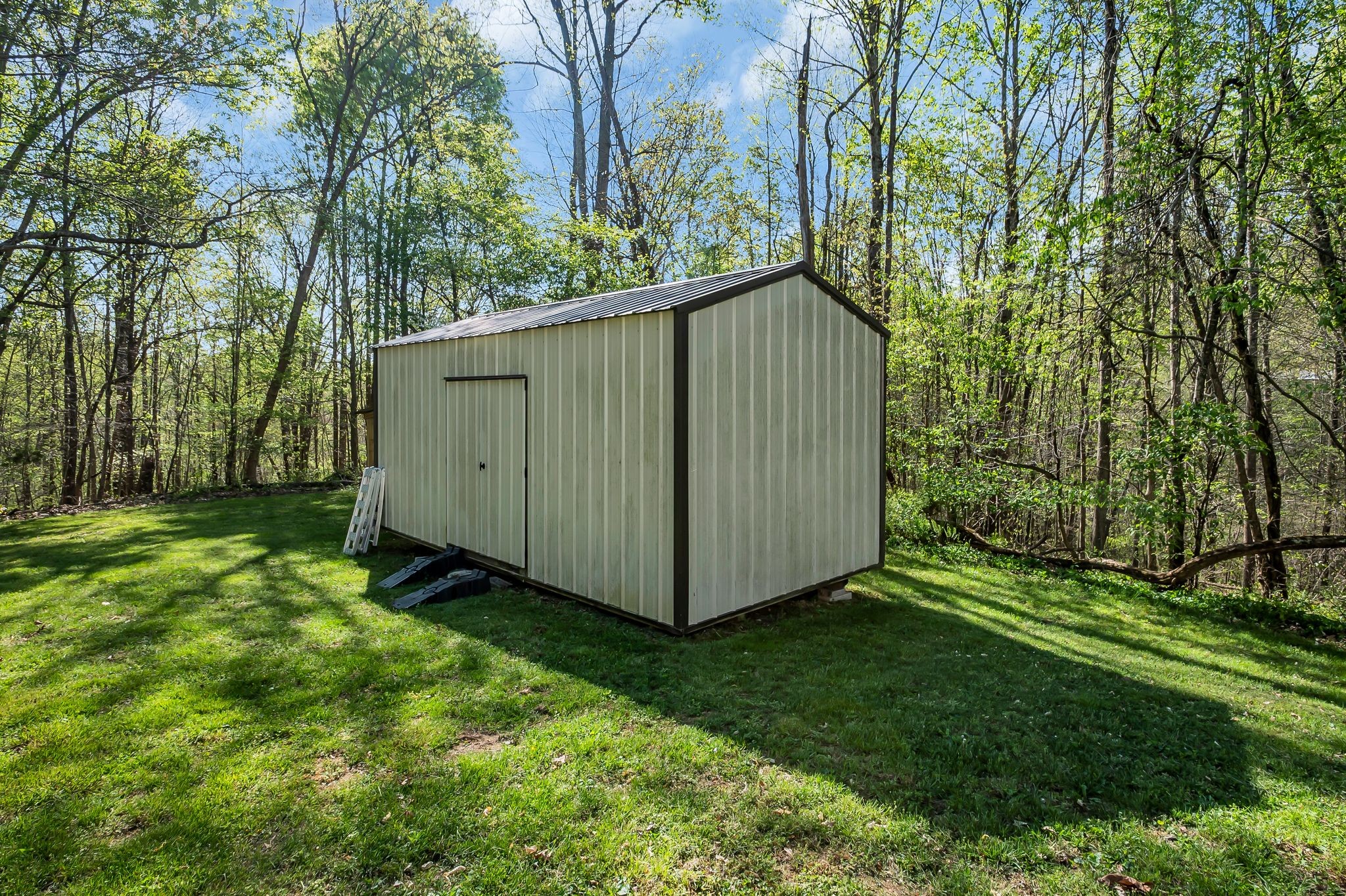 4241 Tanyard Hill Road Lynchburg, TN 37352 - Photo 31 of 50 a view of a backyard with large trees