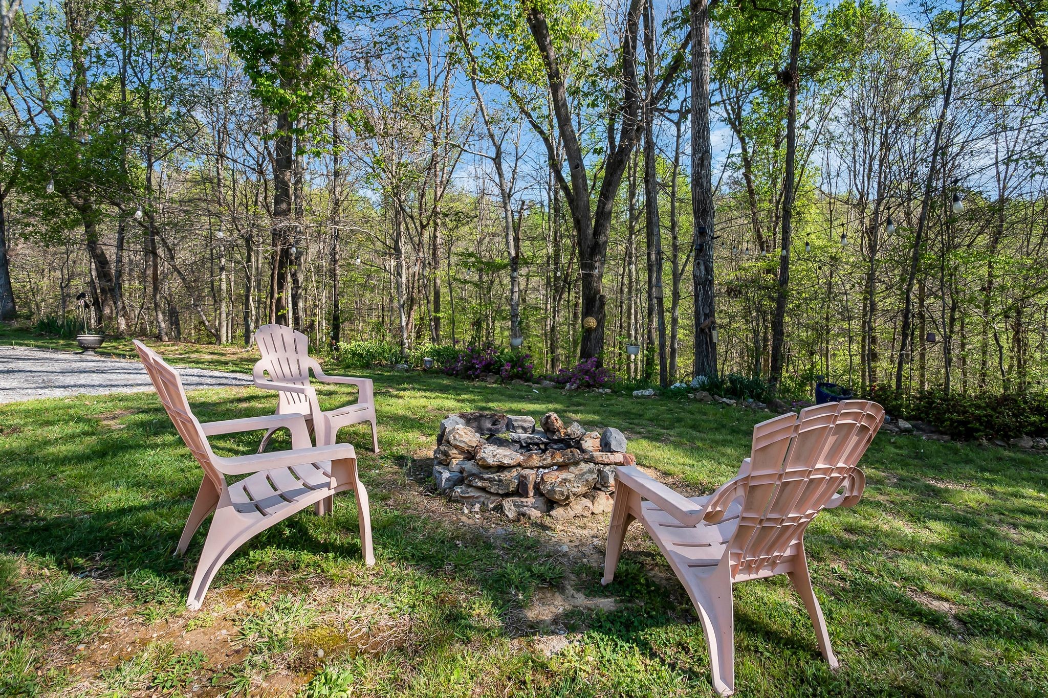 4241 Tanyard Hill Road Lynchburg, TN 37352 - Photo 35 of 50 a view of a chairs and table in backyard of the house