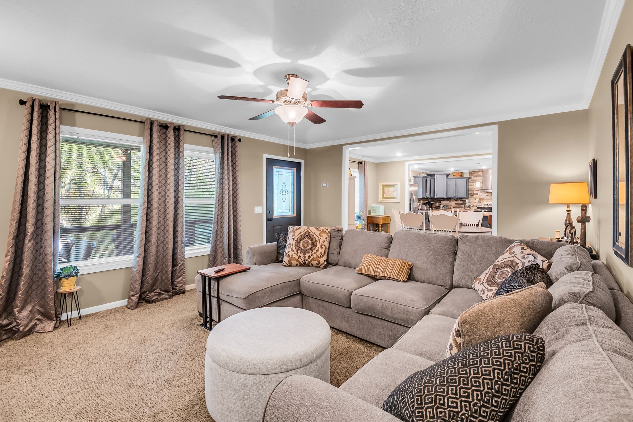 4241 Tanyard Hill Road Lynchburg, TN 37352 - Photo 9 of 50 a living room with furniture a large window and a chandelier