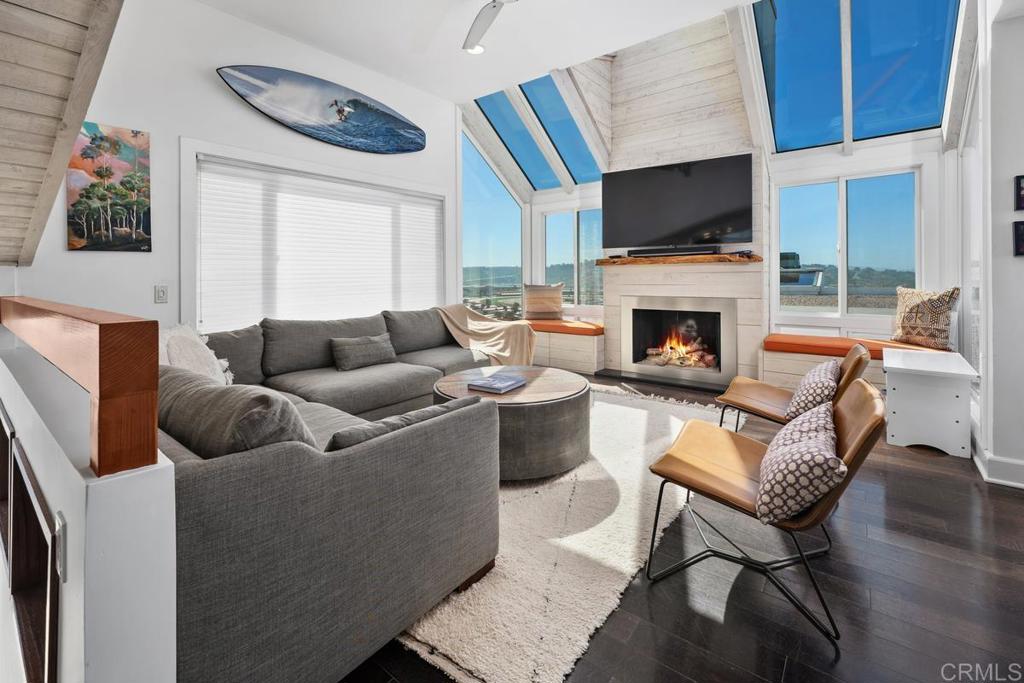 328 Shoemaker Court Solana Beach, CA 92075 - Photo 2 of 19 a living room with furniture a fireplace and a flat screen tv