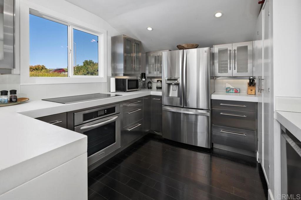328 Shoemaker Court Solana Beach, CA 92075 - Photo 6 of 19 a kitchen with a refrigerator sink and stove