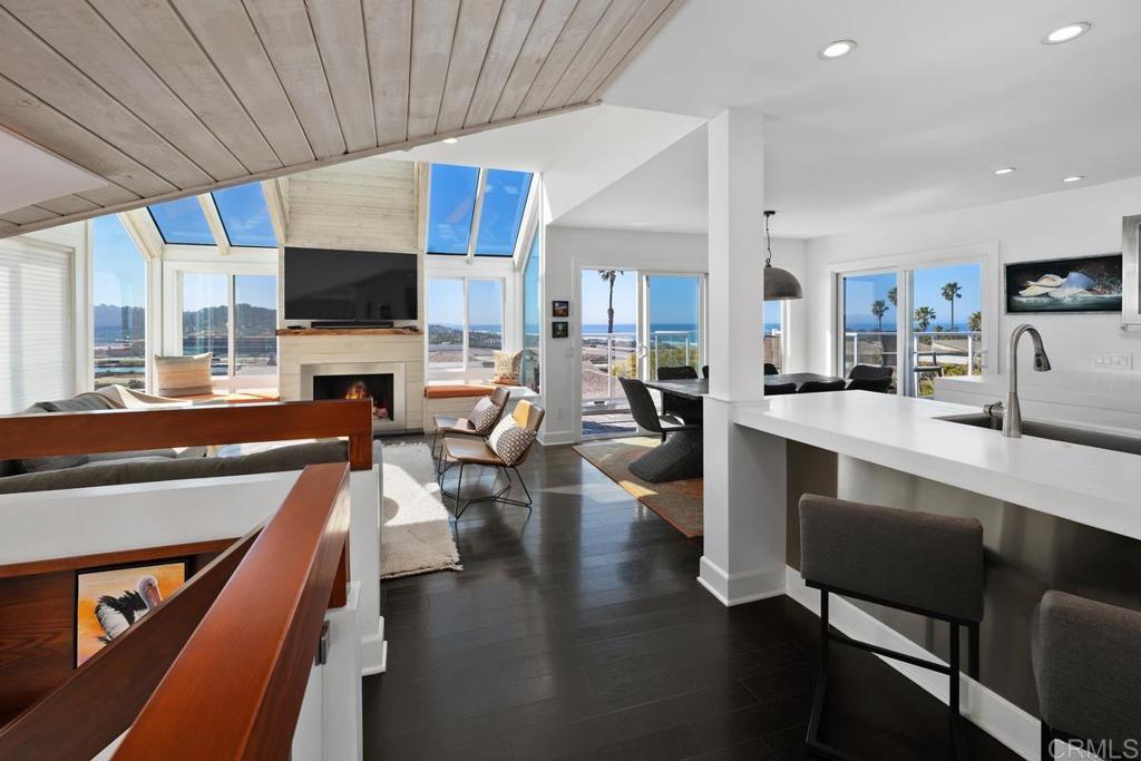 328 Shoemaker Court Solana Beach, CA 92075 - Photo 10 of 19 a living room with stainless steel appliances furniture a flat screen tv and kitchen view