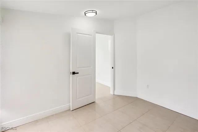 an empty room with closet area