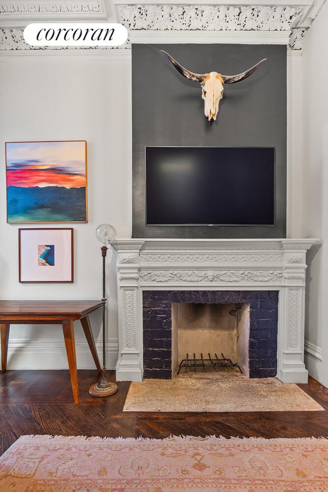 7 West 16th Street Manhattan, NY 10011 - Photo 10 of 21 a living room with a fireplace