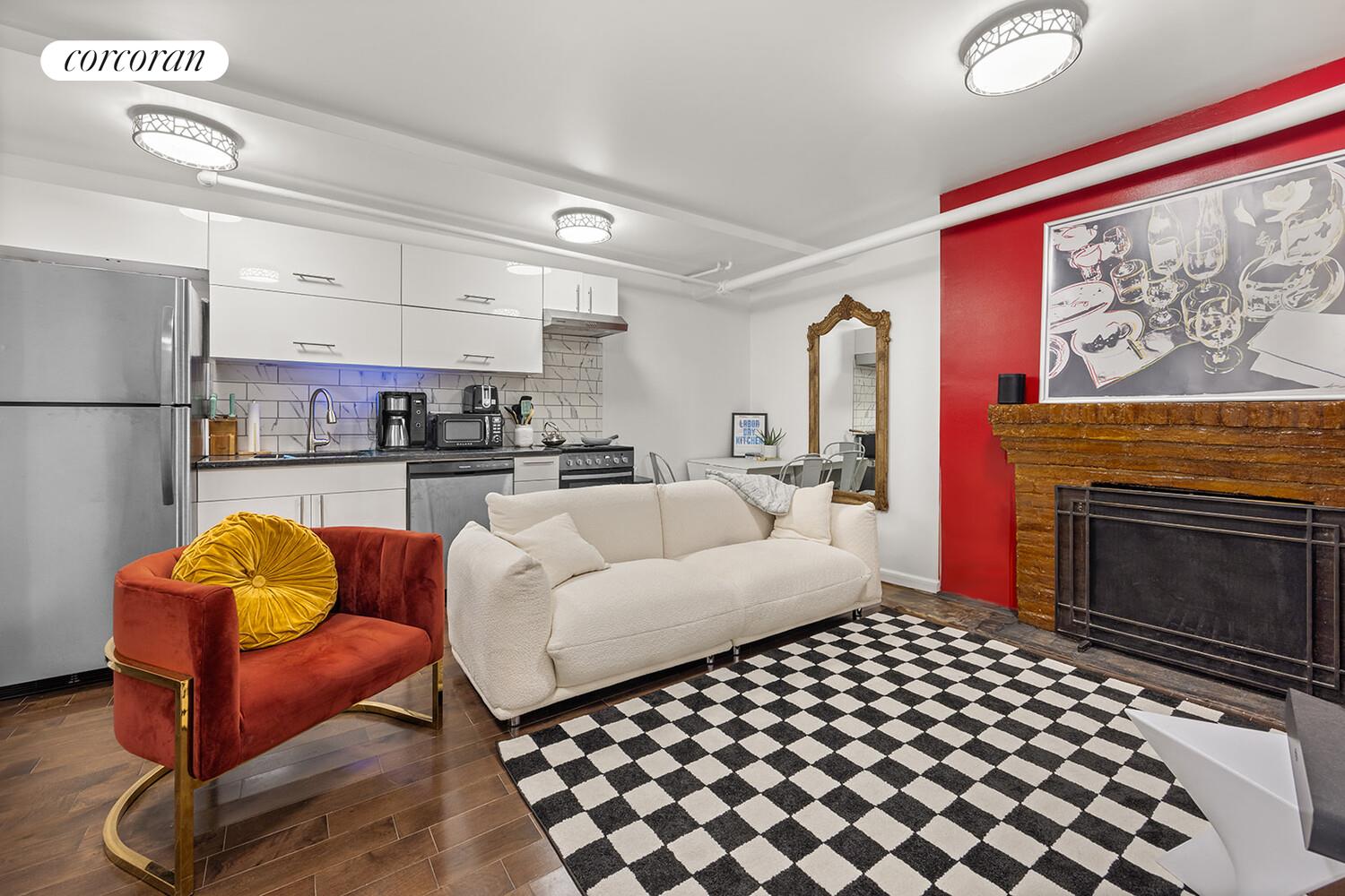7 West 16th Street Manhattan, NY 10011 - Photo 11 of 21 a living room with furniture fireplace and window