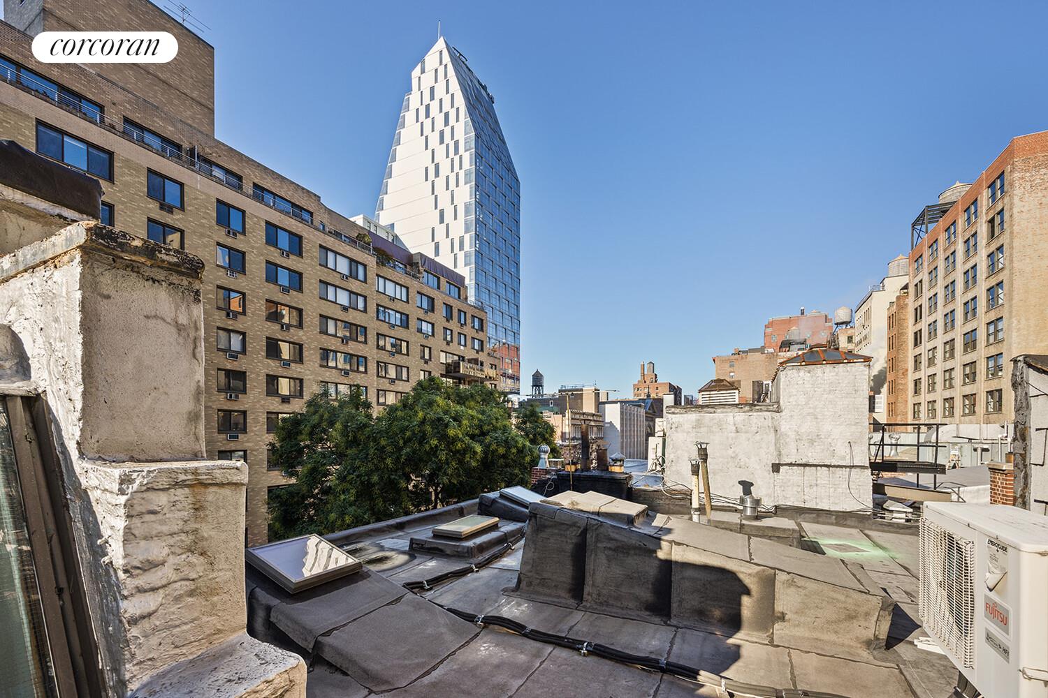 7 West 16th Street Manhattan, NY 10011 - Photo 20 of 21 a view of a patio with couches and table and chairs and potted plants