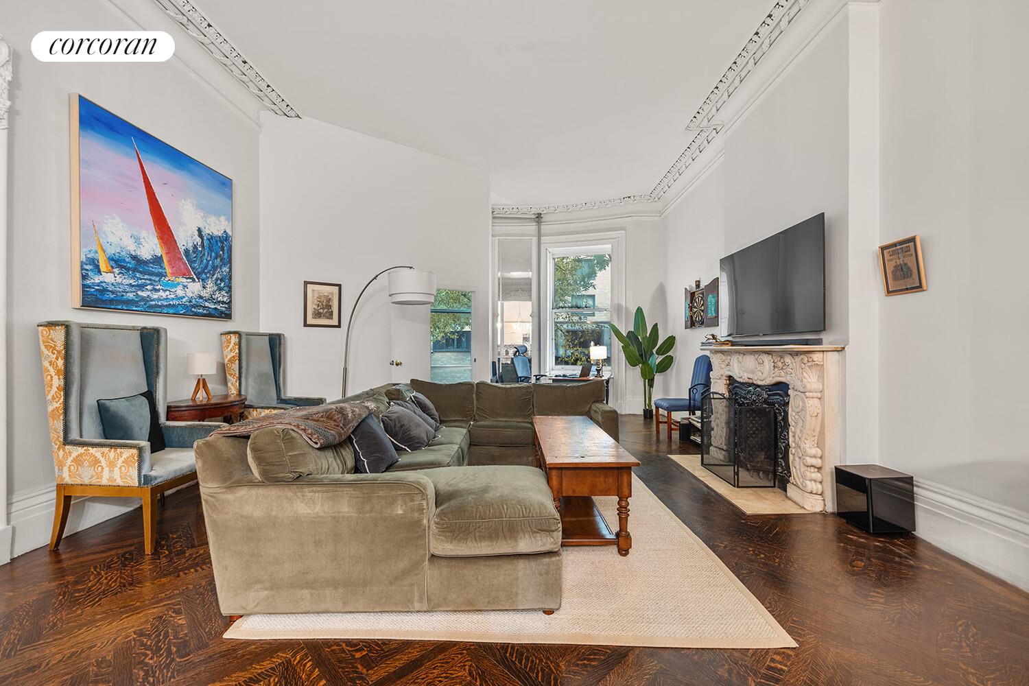 7 West 16th Street Manhattan, NY 10011 - Photo 6 of 21 a living room with fireplace furniture and a flat screen tv