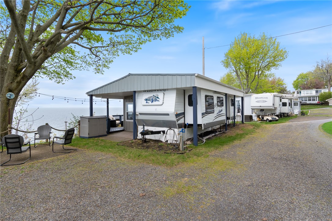 7945 Lake Road, Unit 86 Sodus, NY 14555 - Photo 2 of 22 The METAL ROOF is a super smart addition to this u