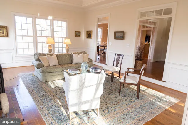 a living room with furniture and a rug