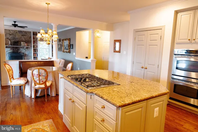 a kitchen with stainless steel appliances granite countertop a stove and a refrigerator