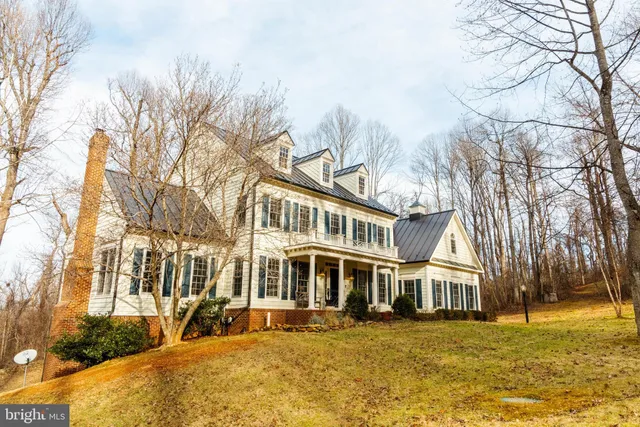 a front view of a building with a yard