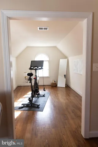 a view of a living room with wooden floor