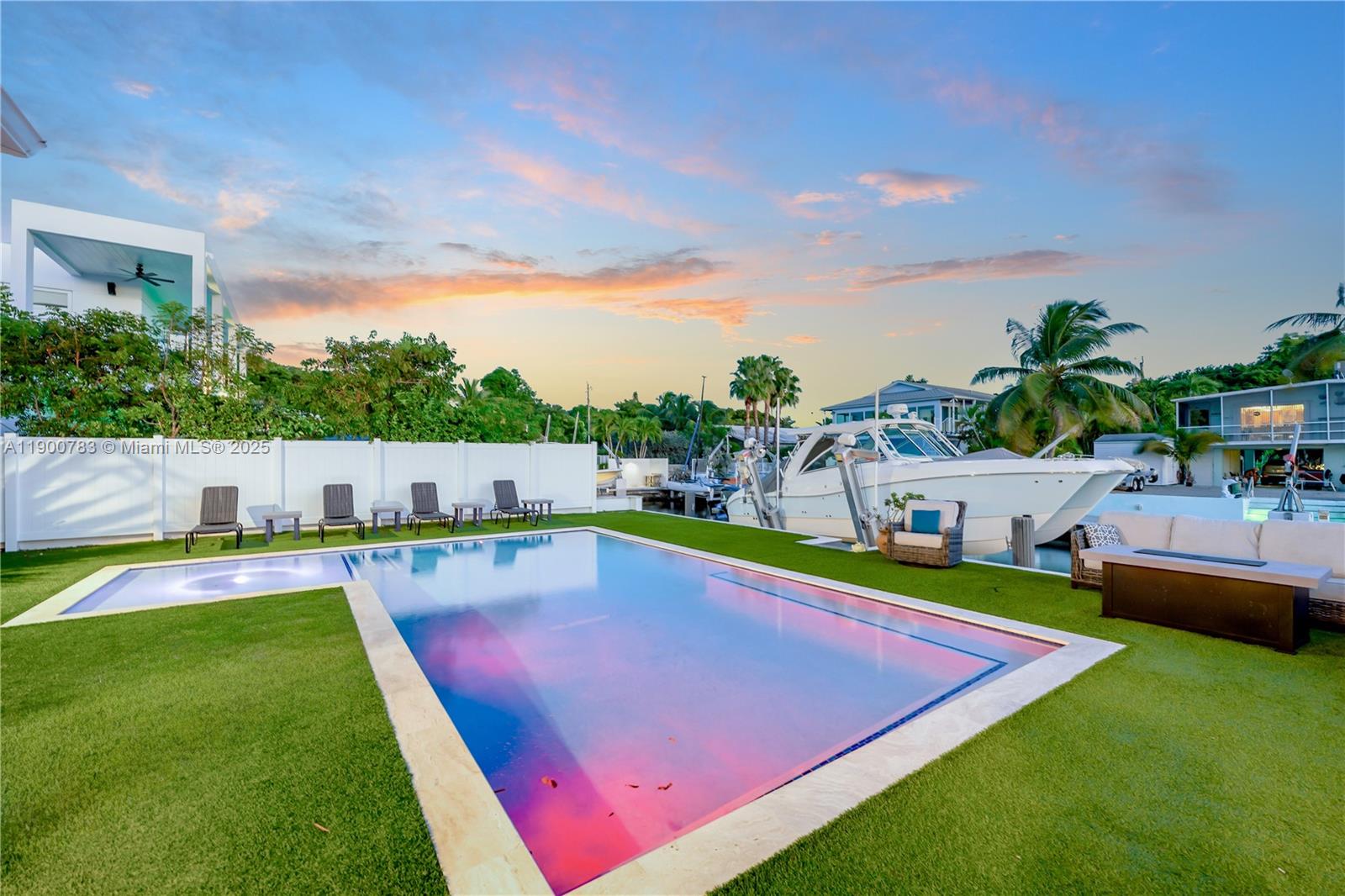 111 Spoonbill Road Tavernier, FL 33070 - Photo 12 of 39 a view of a backyard with swimming pool and seating