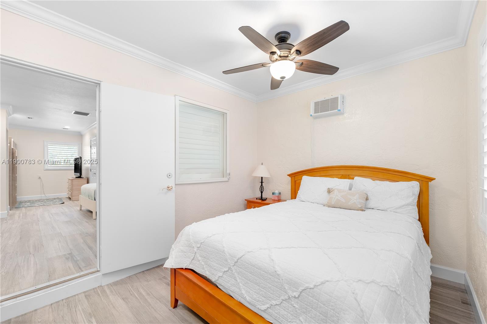 111 Spoonbill Road Tavernier, FL 33070 - Photo 15 of 39 a bedroom with a bed and a chandelier