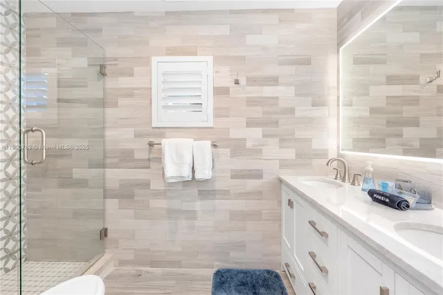 a bathroom with a sink and a shower