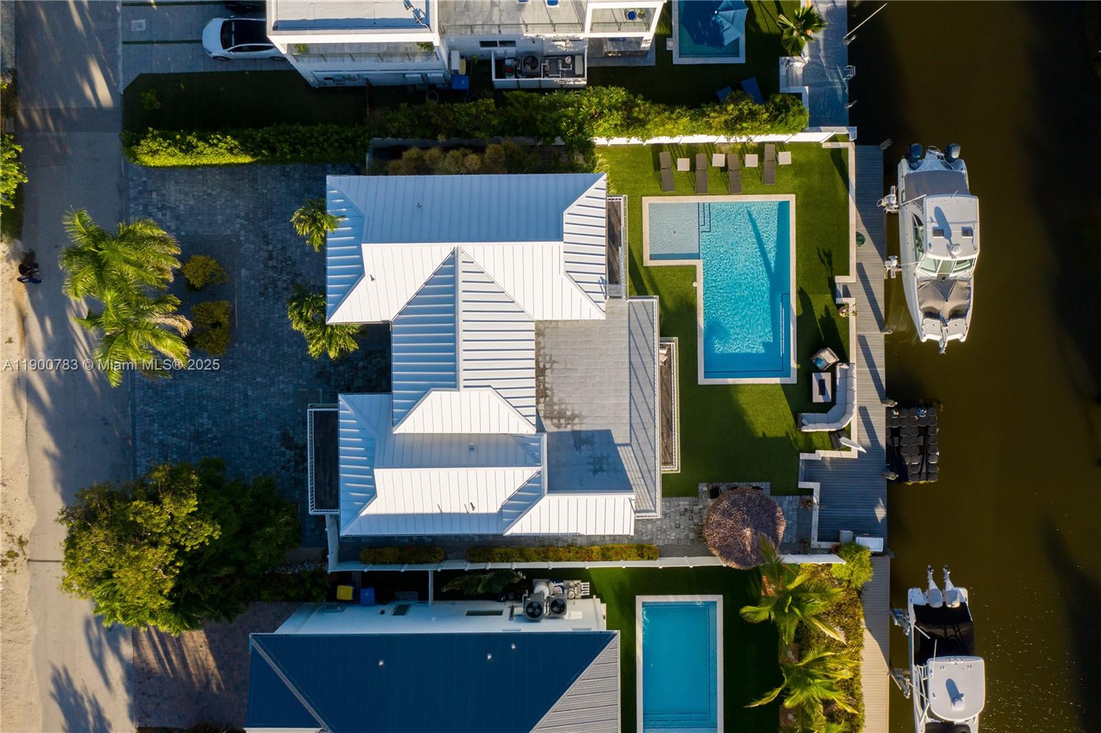 111 Spoonbill Road Tavernier, FL 33070 - Photo 2 of 39 a front view of a house with outdoor seating