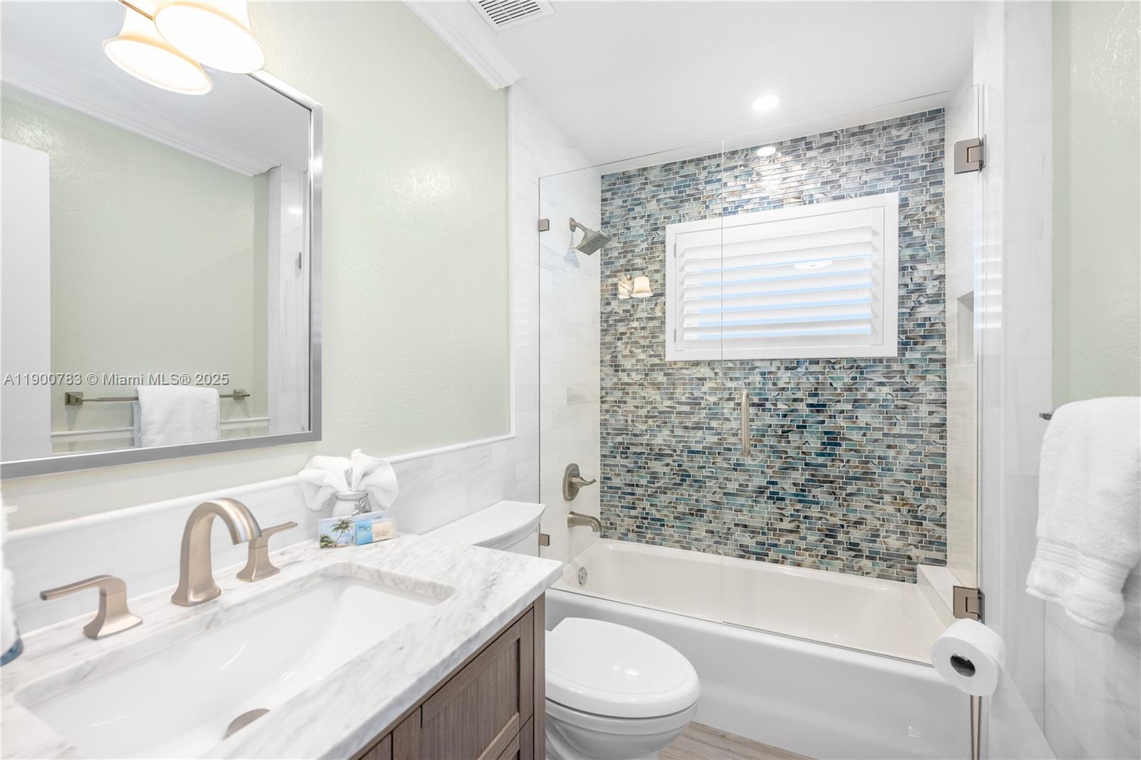 111 Spoonbill Road Tavernier, FL 33070 - Photo 22 of 39 a bathroom with a granite countertop sink toilet and shower