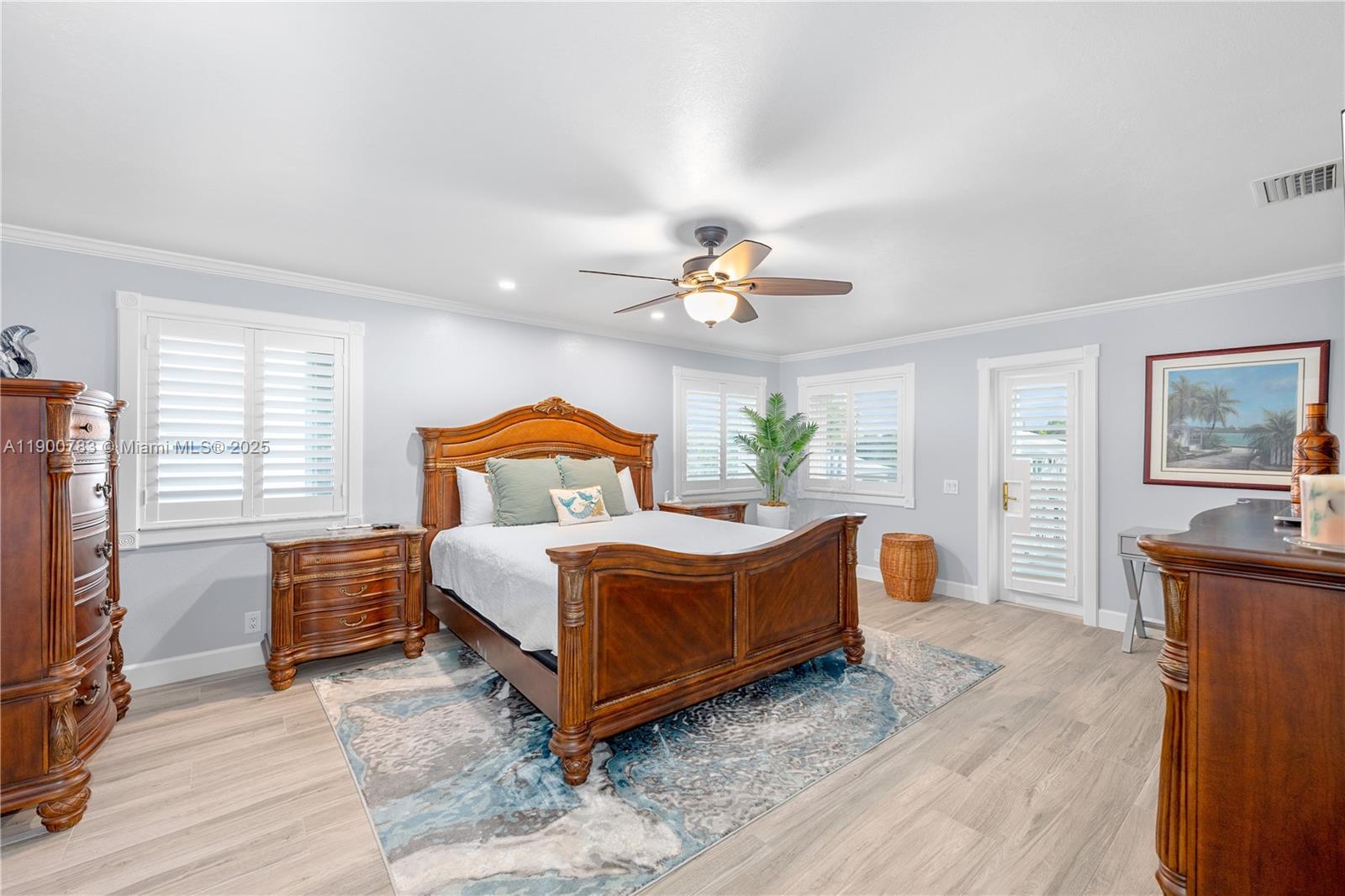 111 Spoonbill Road Tavernier, FL 33070 - Photo 23 of 39 a bedroom with a bed and wooden floor