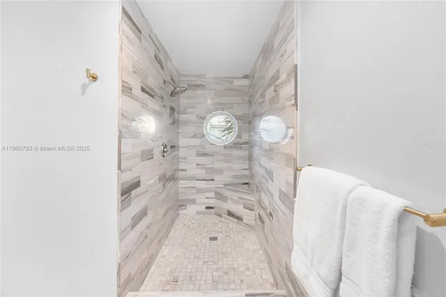 a picture of a bathroom with a sink and a shower curtain