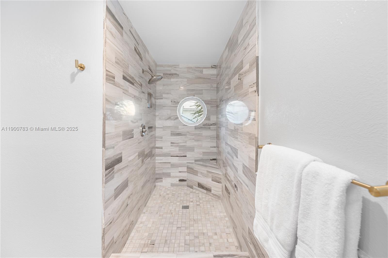 111 Spoonbill Road Tavernier, FL 33070 - Photo 26 of 39 a picture of a bathroom with a sink and a shower curtain