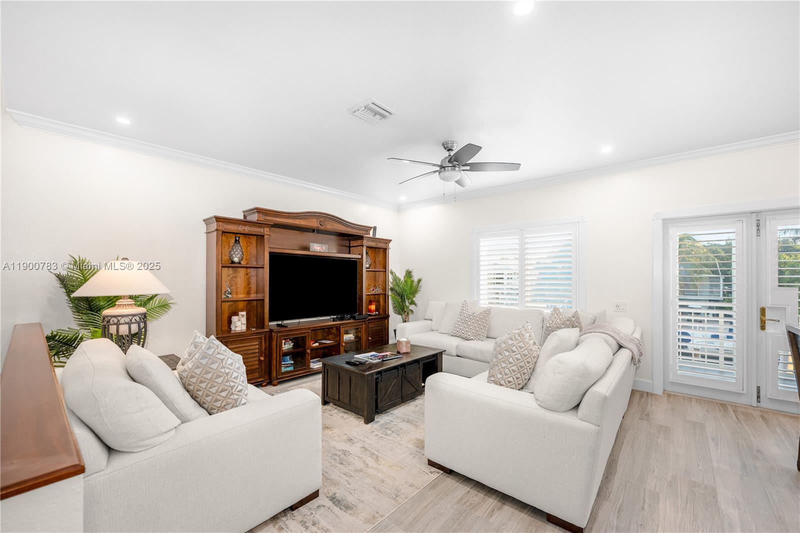 111 Spoonbill Road Tavernier, FL 33070 - Photo 30 of 39 a living room with furniture and a flat screen tv
