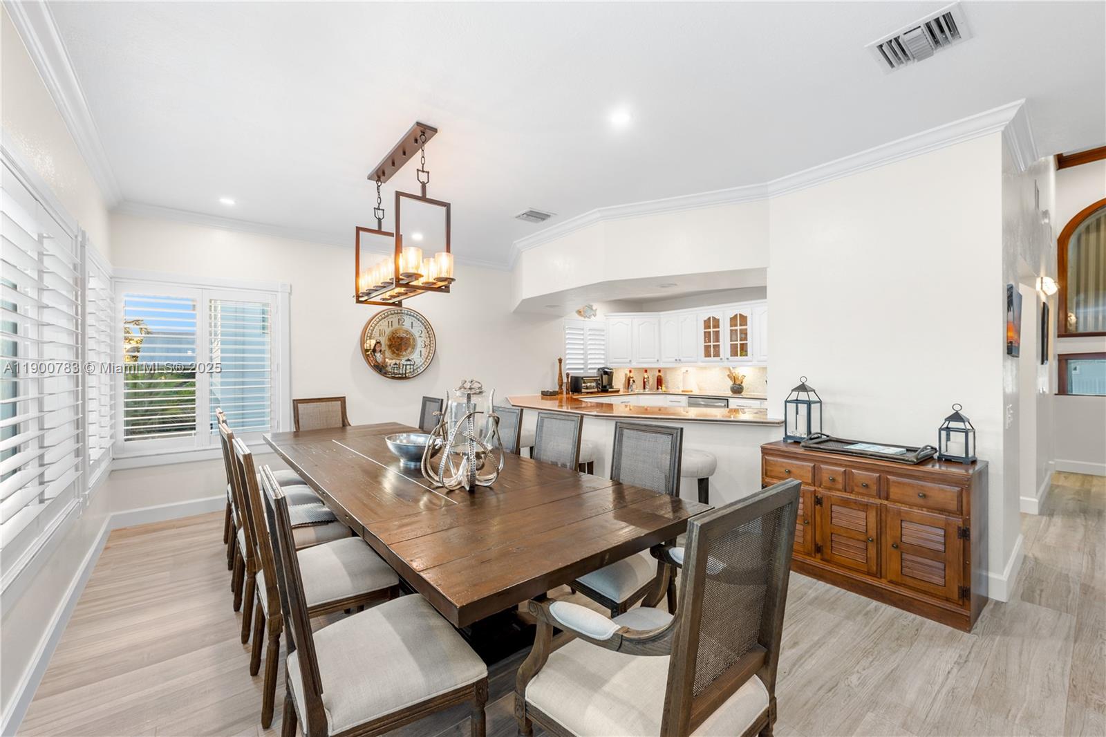 111 Spoonbill Road Tavernier, FL 33070 - Photo 33 of 39 a view of a dining room with furniture and wooden floor