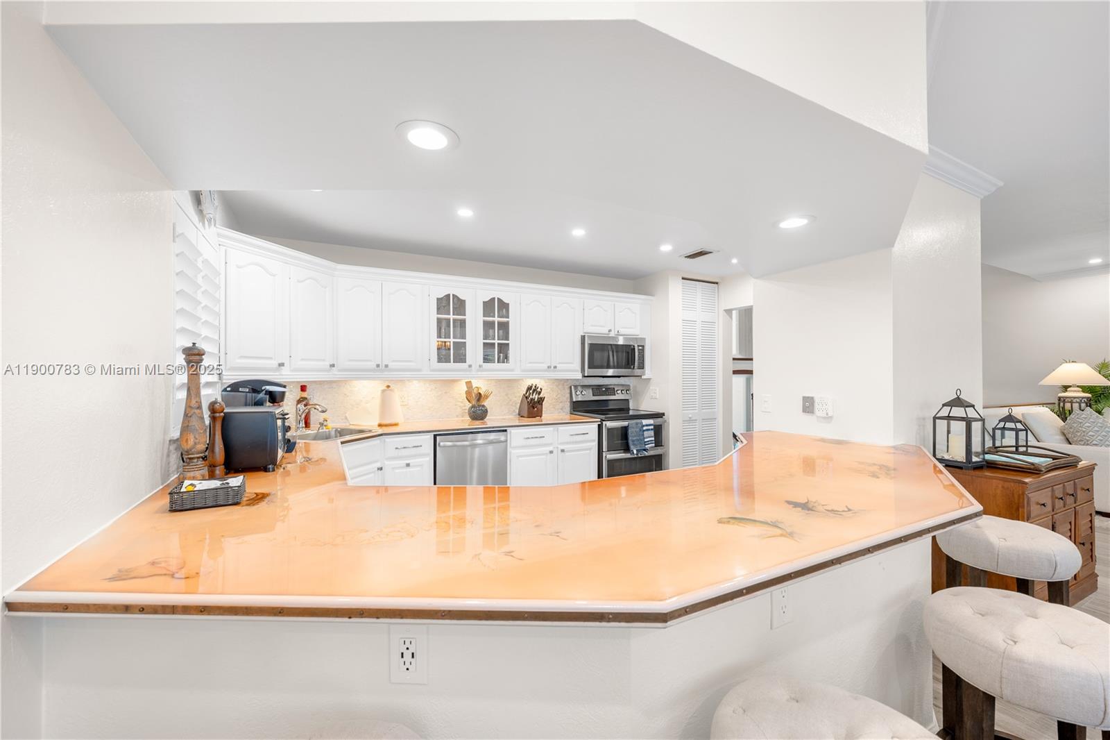 111 Spoonbill Road Tavernier, FL 33070 - Photo 35 of 39 a large kitchen with kitchen island a counter top space a sink stainless steel appliances and cabinets