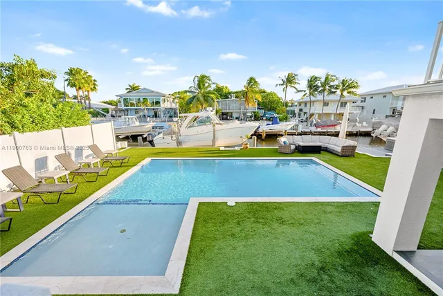 a view of a swimming pool with chairs