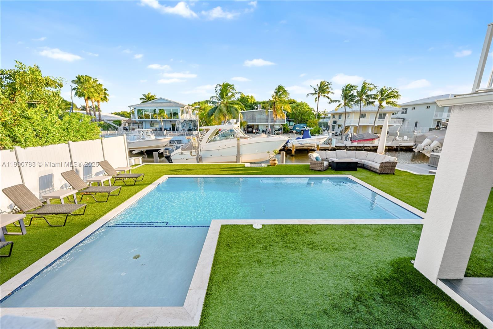 111 Spoonbill Road Tavernier, FL 33070 - Photo 7 of 39 a view of a swimming pool with chairs