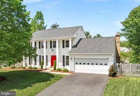 a view of a house with a yard and plants