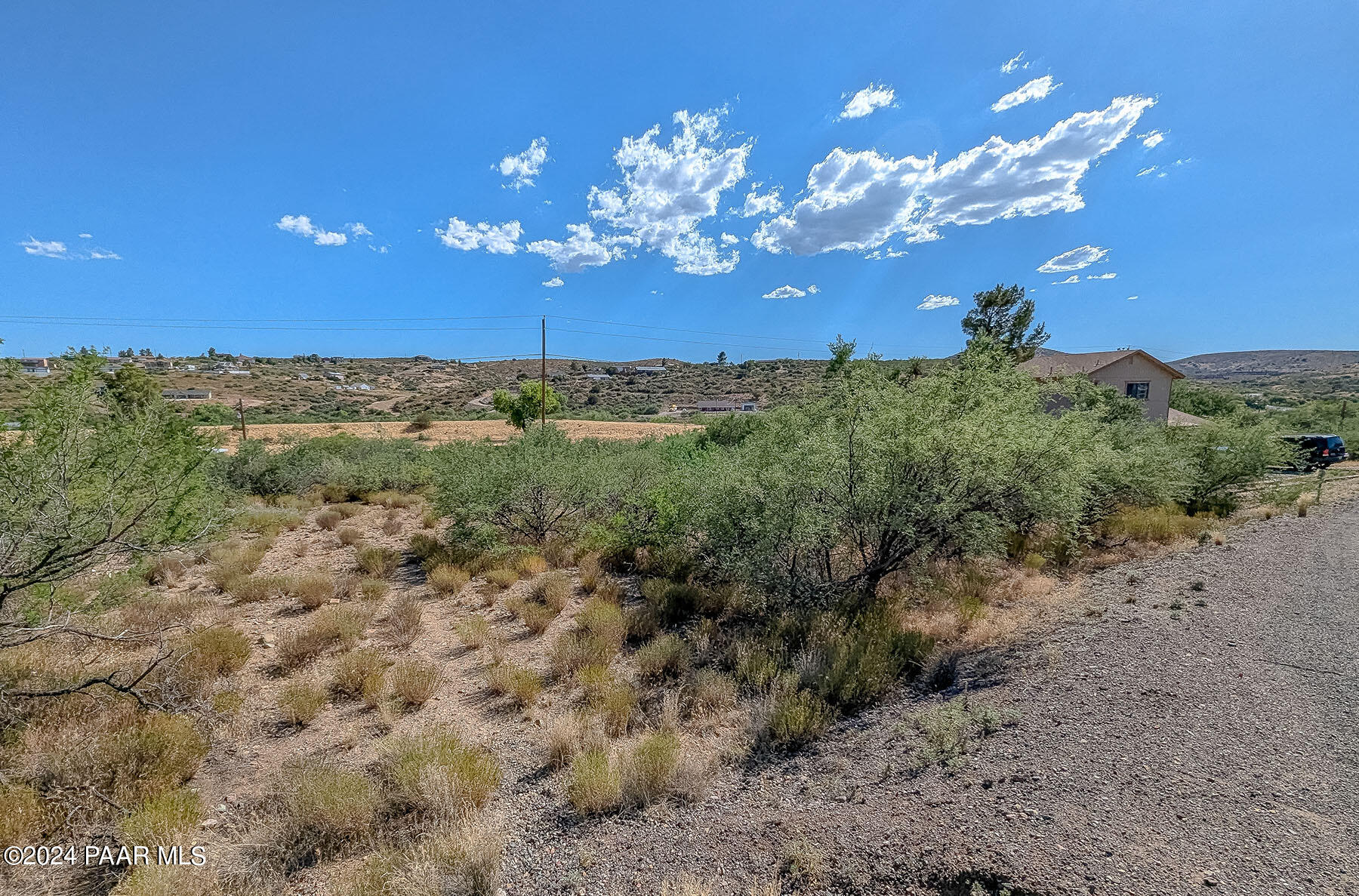 20265 East Lakeside Road Mayer, AZ 86333 - Photo 13 of 20 a view of a big yard with lots of bushes