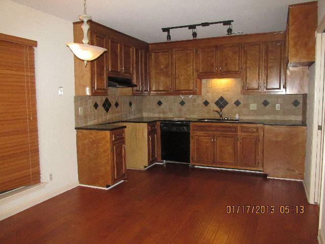 881 Gen George Patton Road Nashville, TN 37221 - Photo 3 of 20 Kitchen has granite countertops, tile backsplash and hardwoods.