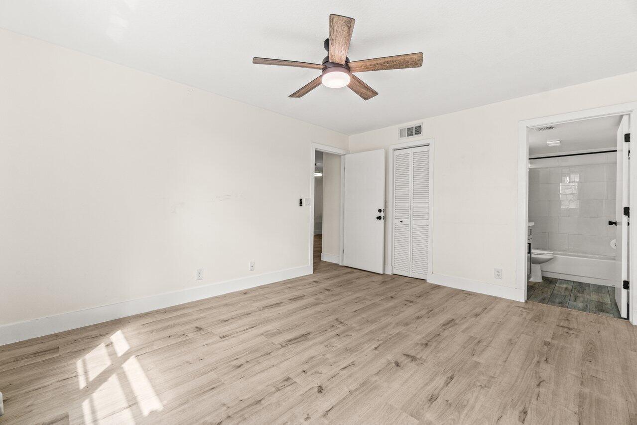 2935 Southwest 22nd Avenue, Unit 1060 Delray Beach, FL 33445 - Photo 11 of 21 wooden floor in an empty room