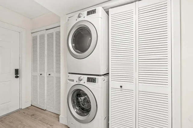 a view of a hallway with washer and dryer
